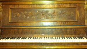 Olivia Newport antique piano
